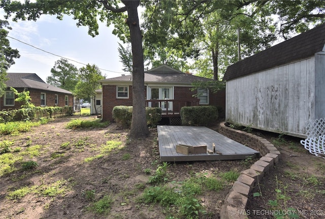 2140 S Columbia Ave, Tulsa, OK 74114 - view of yard featuring a deck and an outbuilding
