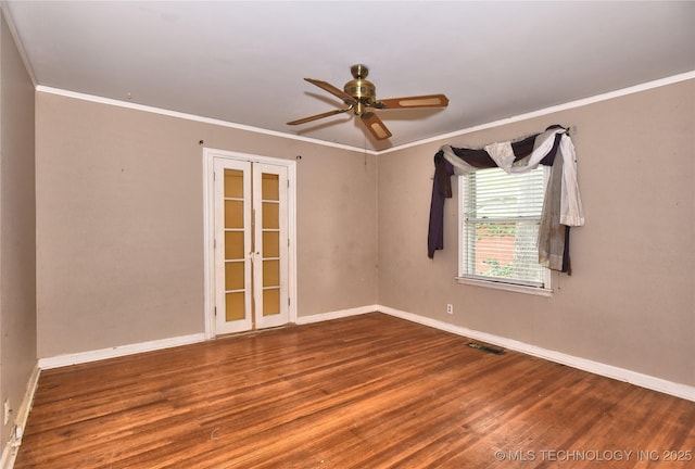 2140 S Columbia Ave, Tulsa, OK 74114 - unfurnished room with wood finished floors, crown molding, baseboards, and a ceiling fan