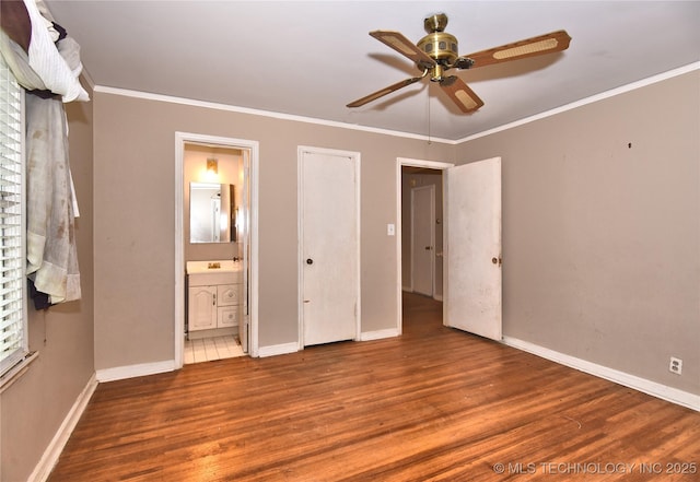 2140 S Columbia Ave, Tulsa, OK 74114 - unfurnished bedroom with wood finished floors, crown molding, baseboards, and ensuite bath