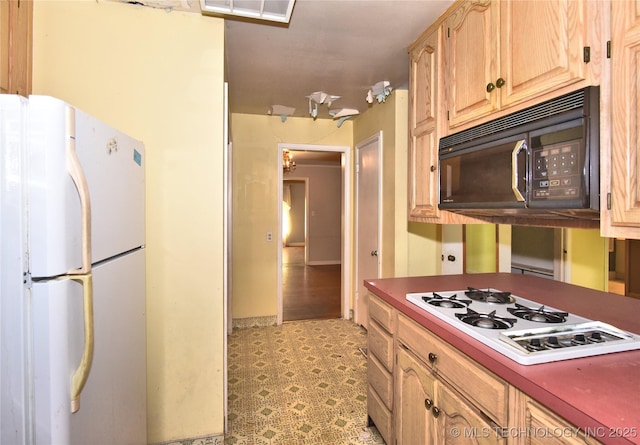 2140 S Columbia Ave, Tulsa, OK 74114 - kitchen with white appliances, light flooring, and light brown cabinetry