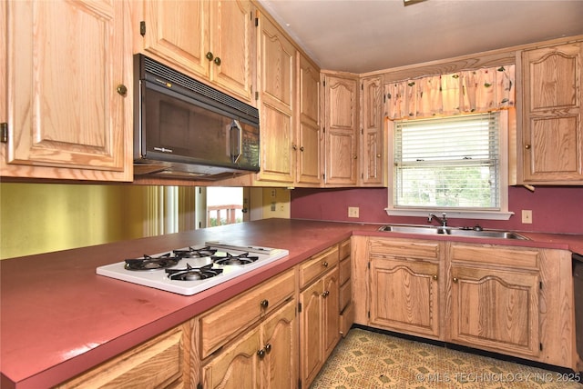 2140 S Columbia Ave, Tulsa, OK 74114 - kitchen featuring black microwave, white stovetop, and a sink
