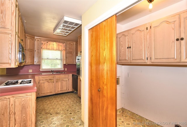 2140 S Columbia Ave, Tulsa, OK 74114 - kitchen with black appliances, a sink, light floors, and light brown cabinetry