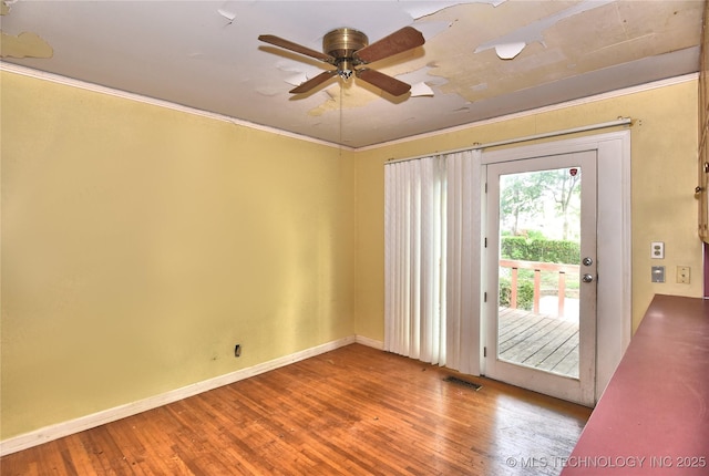 2140 S Columbia Ave, Tulsa, OK 74114 - entryway featuring ceiling fan, hardwood / wood-style floors, baseboards, and crown molding