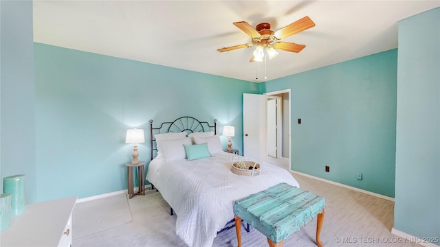 bedroom featuring baseboards and ceiling fan