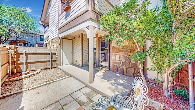 view of patio / terrace featuring fence