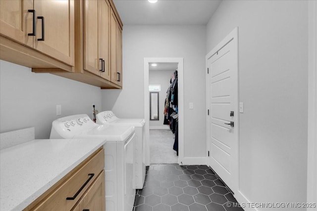 clothes washing area featuring recessed lighting, cabinet space, independent washer and dryer, and dark tile patterned flooring