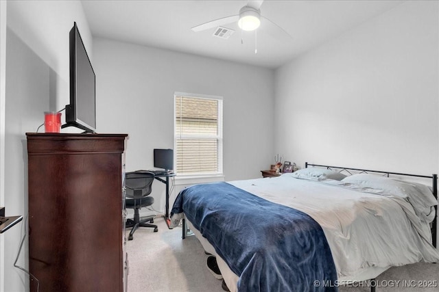 carpeted bedroom featuring visible vents and a ceiling fan