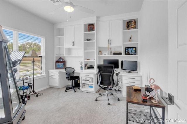 office with ceiling fan, light colored carpet, baseboards, and visible vents