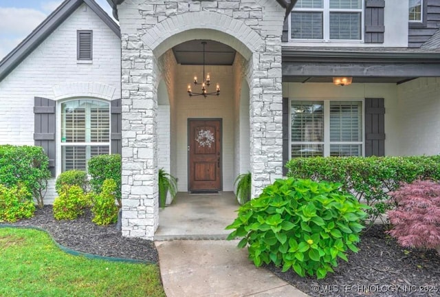 view of exterior entry featuring stone siding