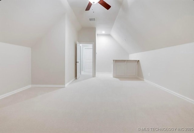 bonus room with carpet floors, ceiling fan, vaulted ceiling, and visible vents