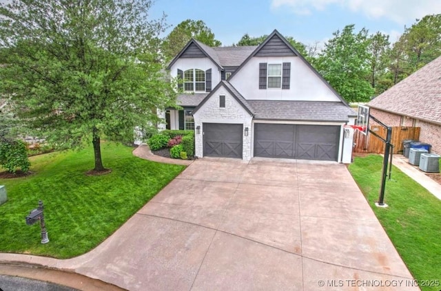 view of front facade featuring fence, a front lawn, a garage, stucco siding, and concrete driveway