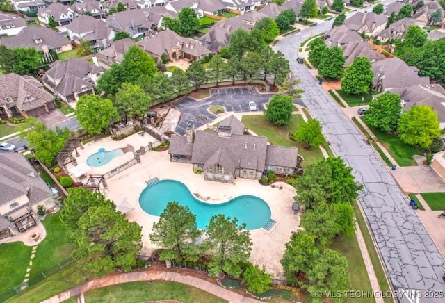 birds eye view of property with a residential view