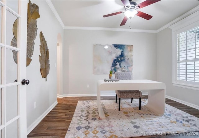 home office featuring dark wood-type flooring, a ceiling fan, baseboards, and a wealth of natural light