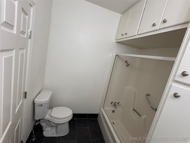 bathroom featuring toilet, tile patterned floors, and shower / tub combination