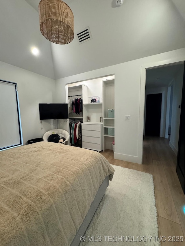 1583 E Clara Ct, Fort Gibson, OK 74434 - bedroom with a walk in closet, visible vents, baseboards, a closet, and light wood finished floors