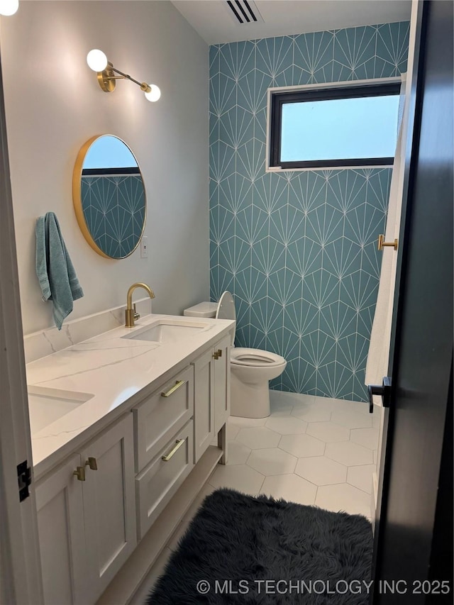 1583 E Clara Ct, Fort Gibson, OK 74434 - bathroom featuring double vanity, a sink, tile patterned floors, and toilet