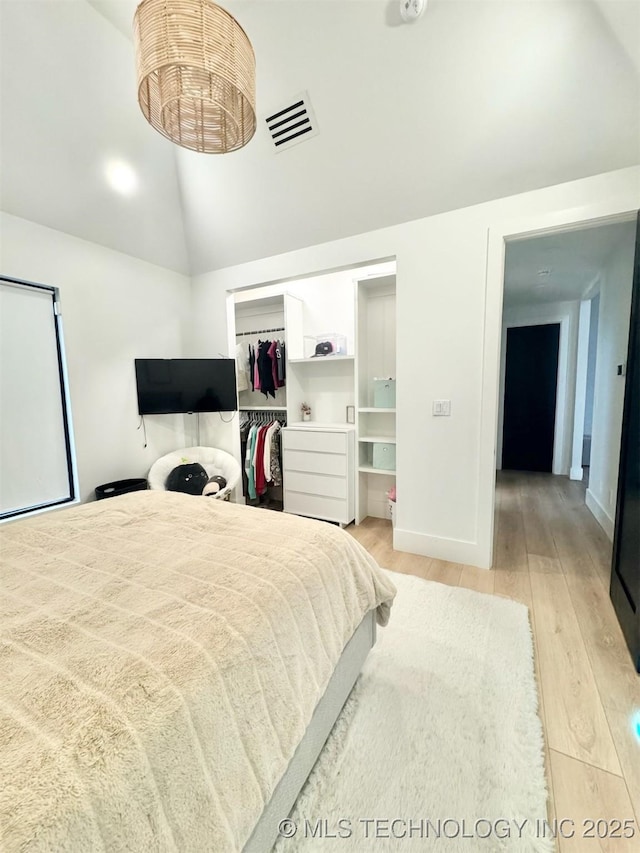 1583 E Clara Ct, Fort Gibson, OK 74434 - bedroom with visible vents, light wood-style floors, a closet, and high vaulted ceiling