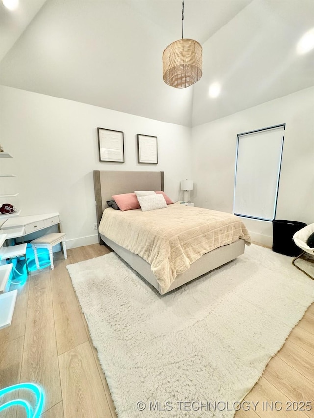 1583 E Clara Ct, Fort Gibson, OK 74434 - bedroom featuring baseboards, wood finished floors, and lofted ceiling