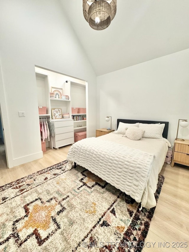 1583 E Clara Ct, Fort Gibson, OK 74434 - bedroom with baseboards, high vaulted ceiling, and wood finished floors