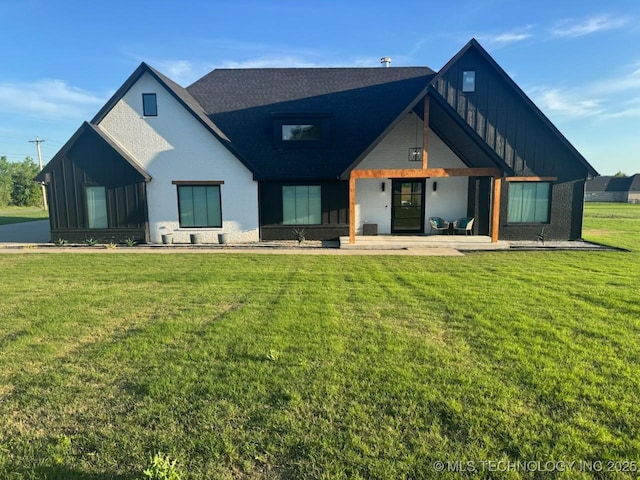1583 E Clara Ct, Fort Gibson, OK 74434 - view of front of home featuring a porch, a front lawn, and board and batten siding