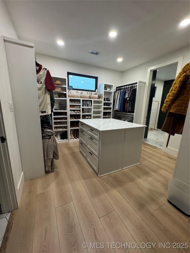 1583 E Clara Ct, Fort Gibson, OK 74434 - walk in closet with light wood-type flooring and visible vents