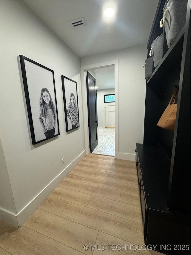 1583 E Clara Ct, Fort Gibson, OK 74434 - corridor featuring visible vents, baseboards, and light wood-type flooring