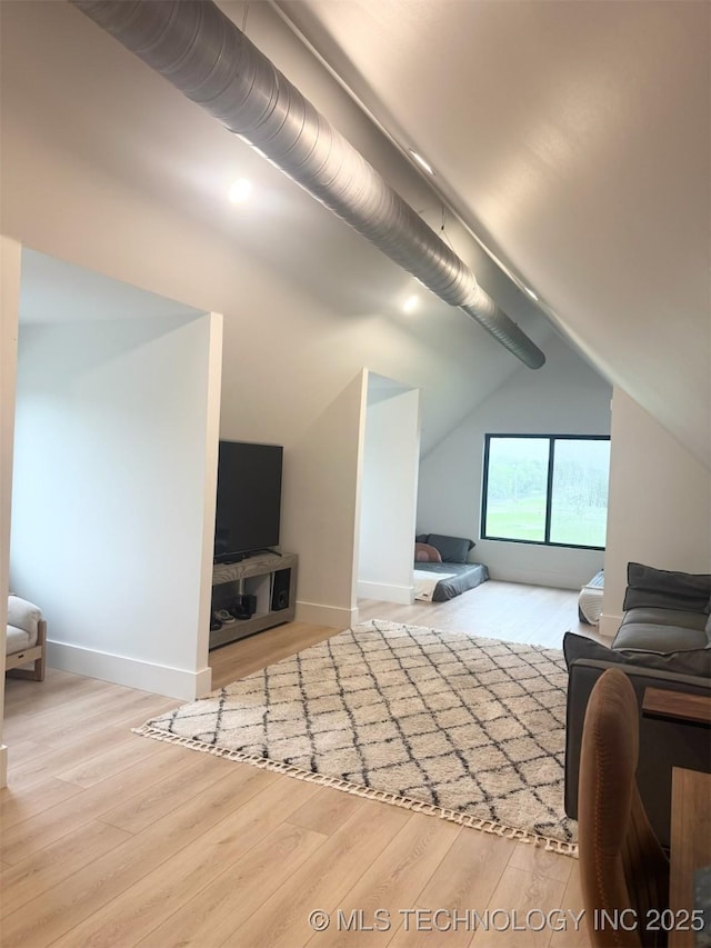 1583 E Clara Ct, Fort Gibson, OK 74434 - living room with baseboards, wood finished floors, and vaulted ceiling