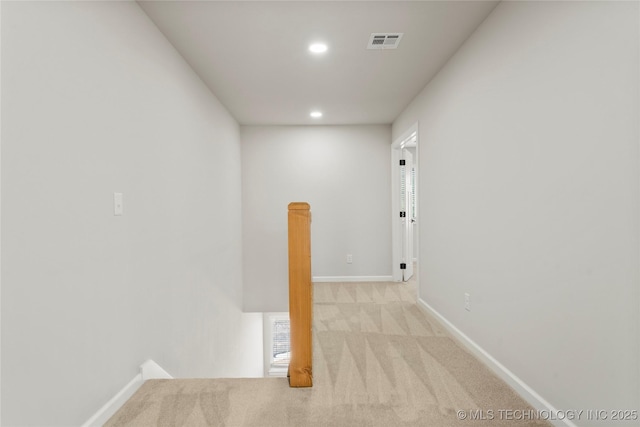 interior space featuring visible vents, recessed lighting, carpet, and baseboards