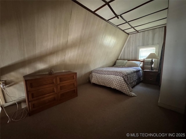 bedroom featuring carpet flooring and wooden walls