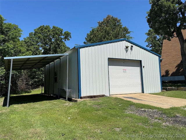garage featuring concrete driveway and a detached garage