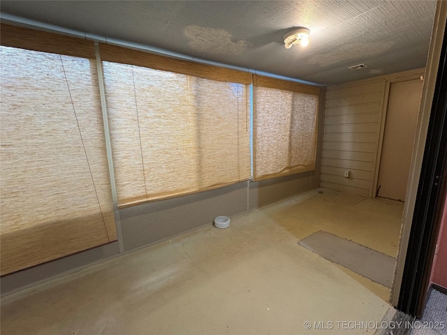 interior space featuring visible vents and concrete floors