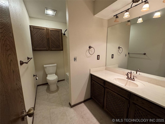 full bathroom featuring vanity, baseboards, toilet, and tile patterned flooring