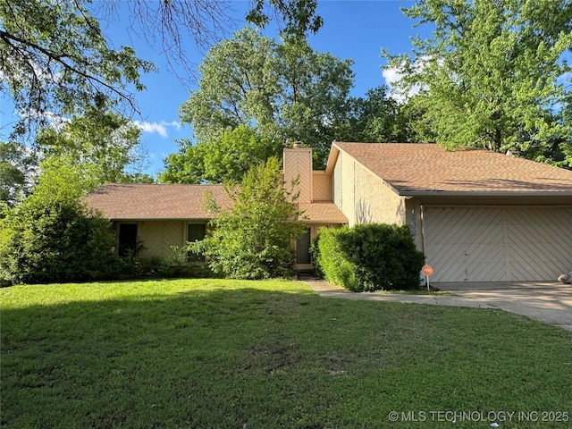 ranch-style home with roof with shingles, driveway, a chimney, and a front yard