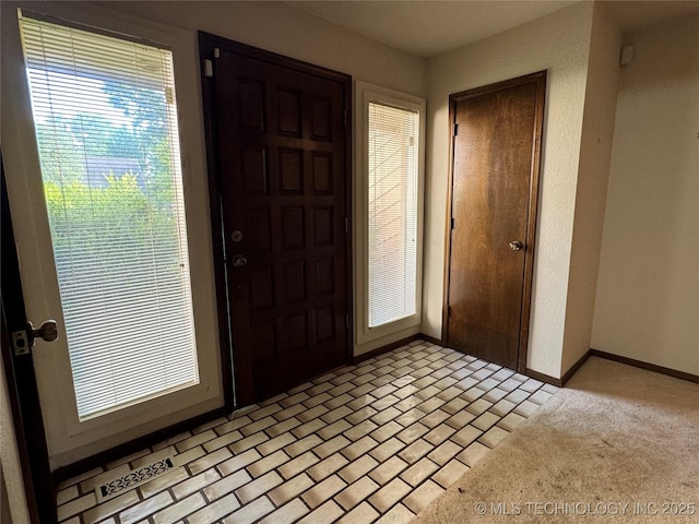 entrance foyer featuring baseboards