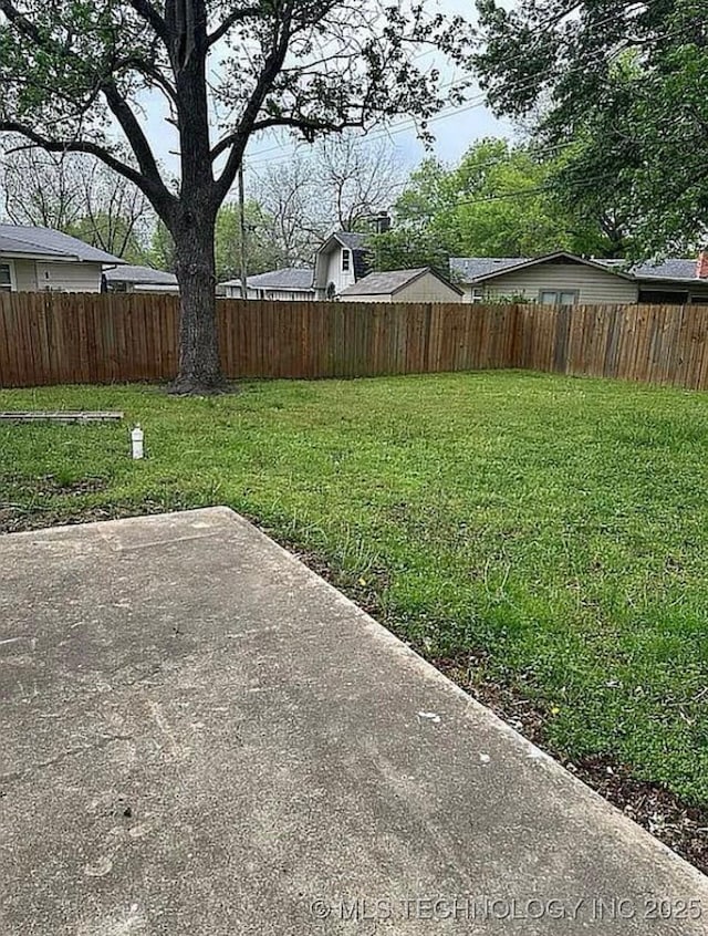 view of yard with a fenced backyard and a patio area