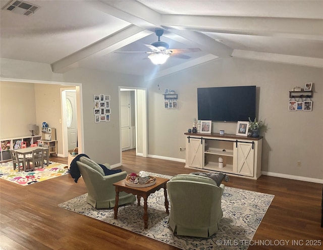 living area featuring a ceiling fan, visible vents, wood finished floors, baseboards, and lofted ceiling with beams