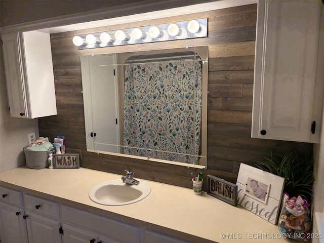 602 Flamingo Rd, Mcalester, OK 74501 - bathroom featuring vanity, wooden walls, and a shower with shower curtain