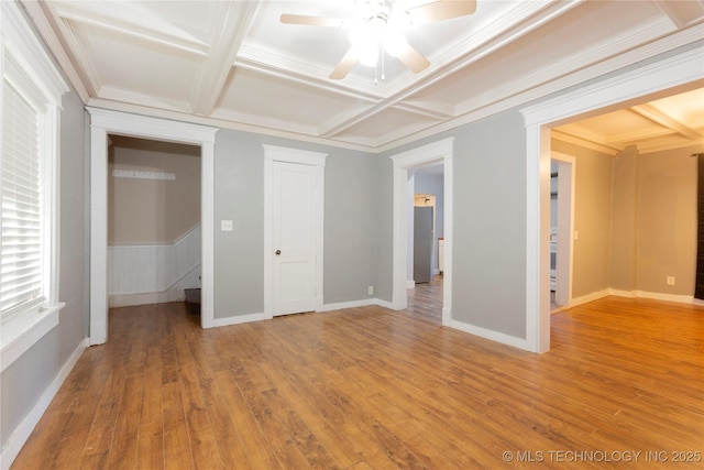 unfurnished bedroom featuring crown molding, coffered ceiling, and light wood-type flooring