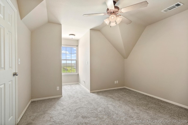 bonus room featuring ceiling fan, visible vents, vaulted ceiling, and carpet