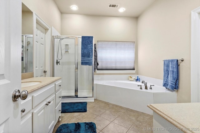 full bathroom with vanity, tile patterned floors, a shower stall, visible vents, and a garden tub