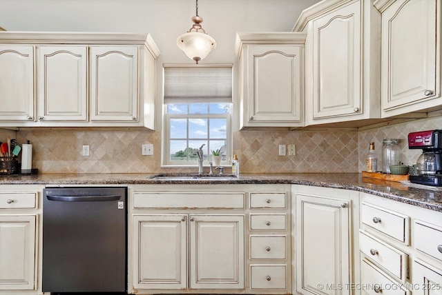kitchen featuring cream cabinets, tasteful backsplash, a sink, and dishwasher