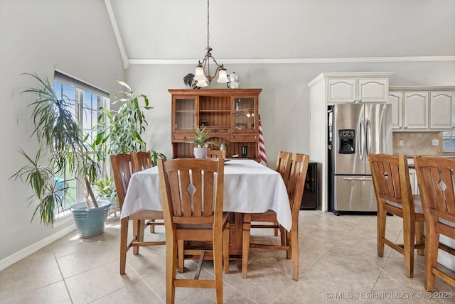 dining space featuring light tile patterned floors, crown molding, vaulted ceiling with beams, and a notable chandelier