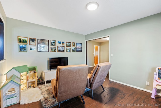 home office featuring baseboards and wood finished floors