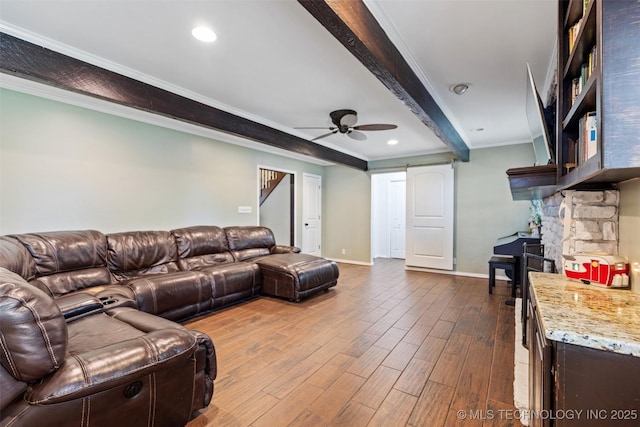 living room with ceiling fan, crown molding, beam ceiling, baseboards, and dark wood-style floors