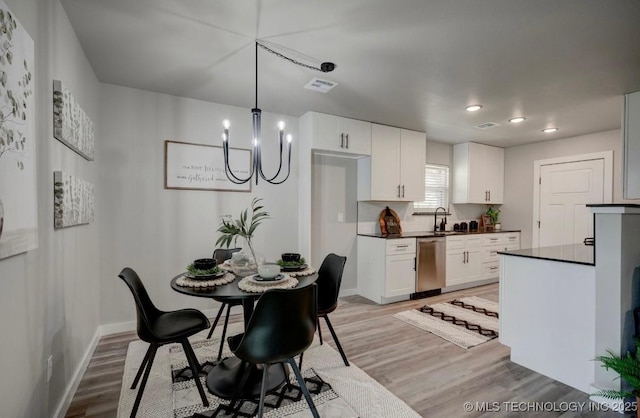 dining room with visible vents, baseboards, a chandelier, light wood-style floors, and recessed lighting