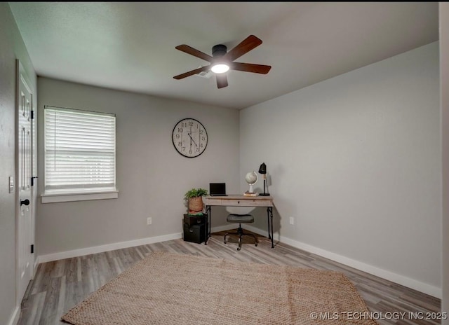 office with baseboards, ceiling fan, and wood finished floors