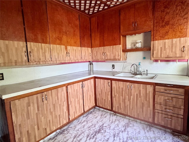 kitchen with a sink and light countertops