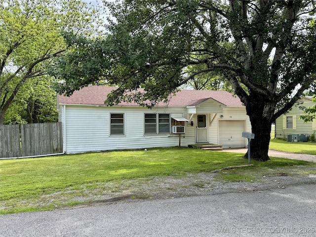 ranch-style home featuring a garage, driveway, cooling unit, and a shingled roof