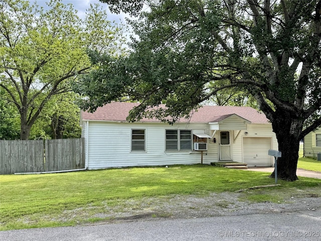 single story home featuring a garage, a shingled roof, driveway, and cooling unit