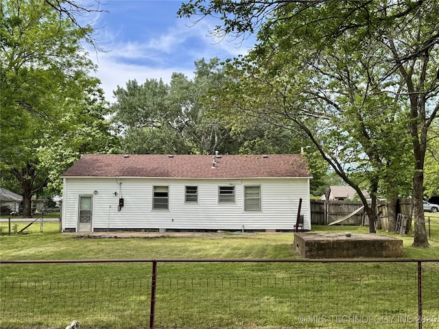 rear view of house featuring roof with shingles